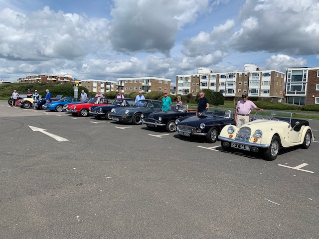 Classic cars meeting on the cliff top